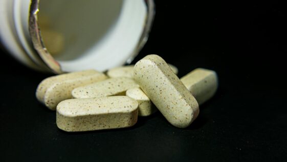Medicine Capsules on the Black Background