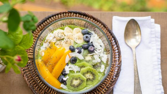 sliced fruit on green and brown ceramic bowl