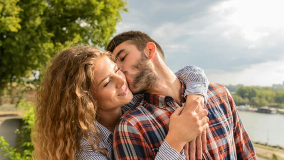 Man Kissing Woman