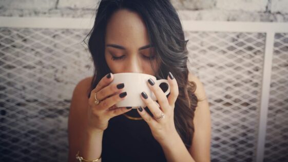 woman drinking with cup