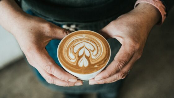 focus photography of coffee artwork