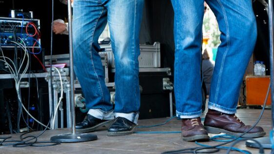 a pair of legs with jeans and shoes