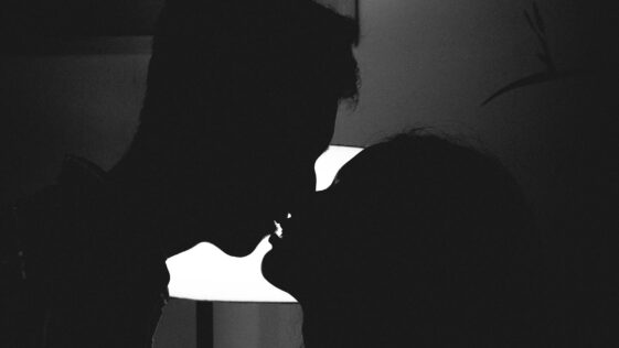 Silhouette Photo of Man and Woman Kissing