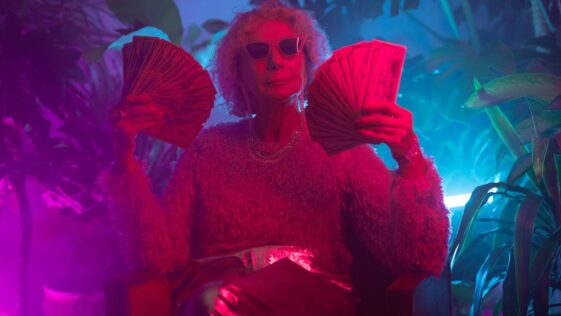 Photo of an Elderly Woman Holding Money