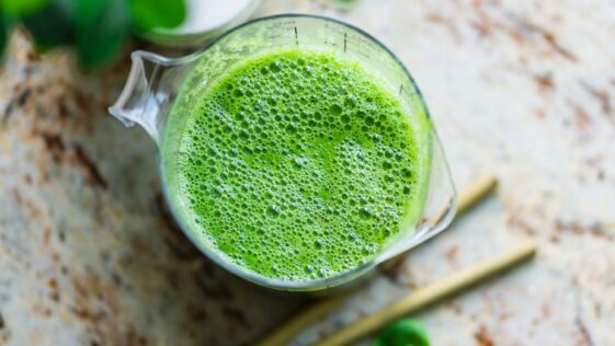 pitcher of green beverage