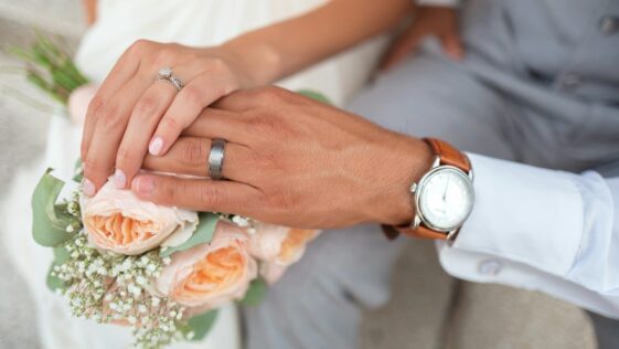 man and woman holding hands
