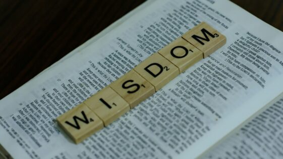 a scrabbled word spelling the word w is down on top of a