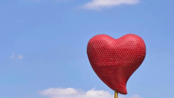 red heart balloon under blue sky during daytime