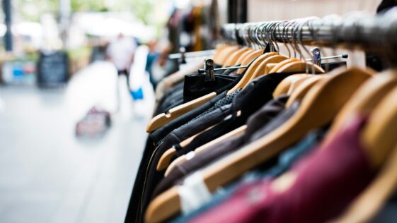 selective focus photography of hanged clothes