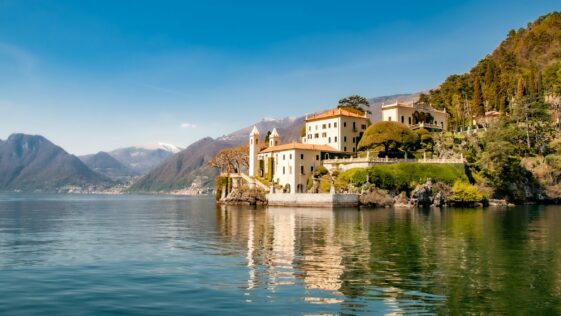 white concrete building near body of water during daytime