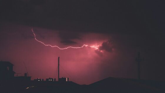 lightning during night time photo