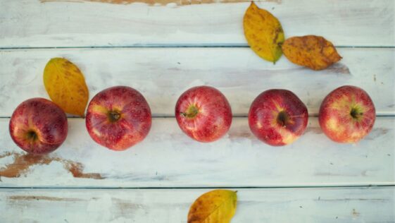 five honeycrisp apples on table