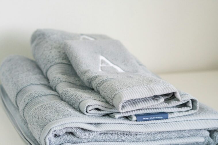A stack of folded towels sitting on top of a table