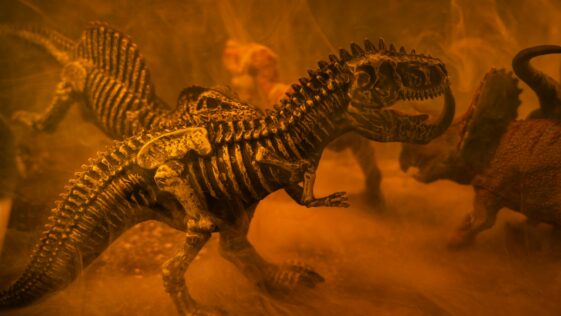 black and brown dinosaur toy
