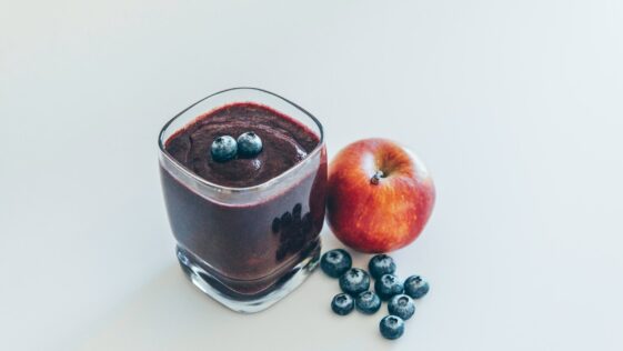 red apple on white surface