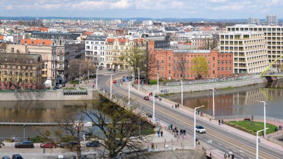 a view of a city with a bridge over a river