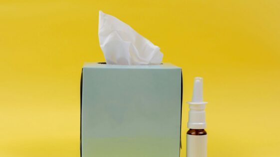 white and brown bottle beside white tissue box