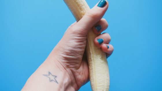person holding peeled banana fruit