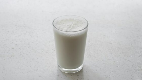 clear drinking glass with brown liquid