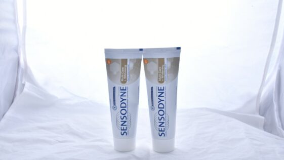 white and black plastic tube bottle