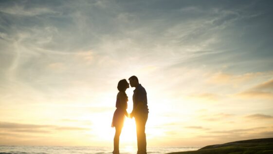 silhouette of man and woman about to kiss