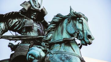 man riding horse statue during daytime
