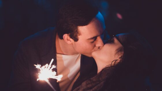 man and woman kissing eachther