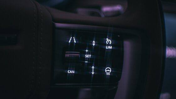 a close up of a car dashboard with buttons