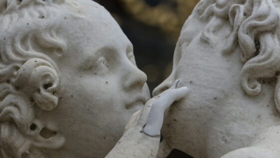 white concrete statue of man
