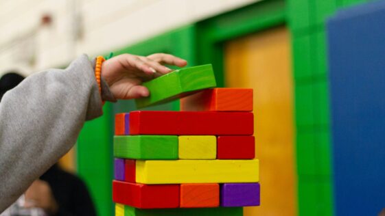 person piling blocks