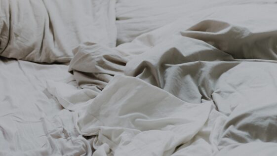 white pillows and bed comforter