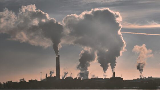 silhouette of building under white clouds during daytime