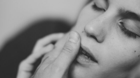 grayscale photo of womans face