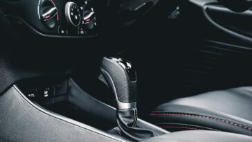 black and gray car gear shift lever